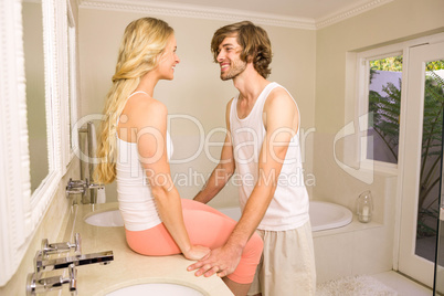 Cute couple embracing in the bathroom