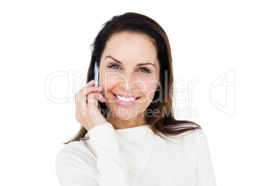 Cheerful brunette with her mobile phone calling someone