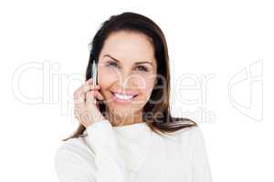 Cheerful brunette with her mobile phone calling someone