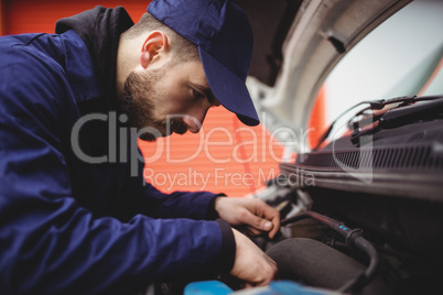 Mechanic fixing a van