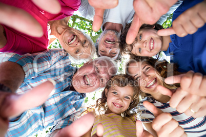 Smiling family standing in a circle