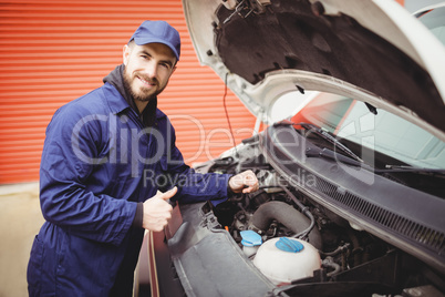Mechanic fixing  a van