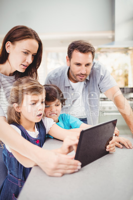 Family using digital tablet