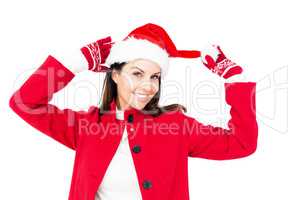 Beautiful brunette holding her santa hat