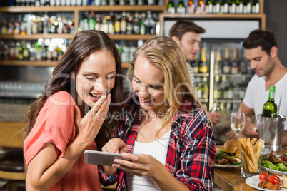 Women looking at a selfie they took