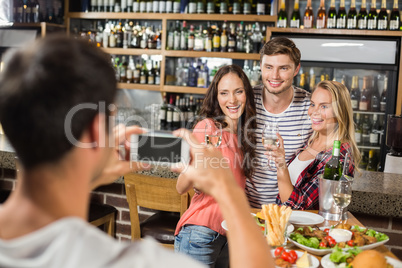 Man taking picture of friends