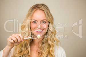Beautiful blonde about to brush her teeth