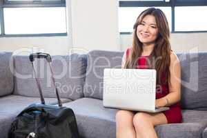 Beautiful business woman using laptop