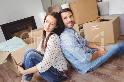 Happy couple with cardboard boxes