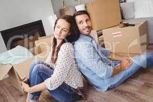 Happy couple with cardboard boxes