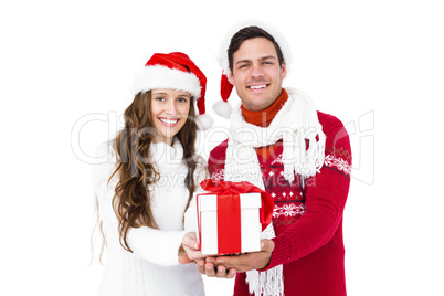 Festive couple holding christmas gift