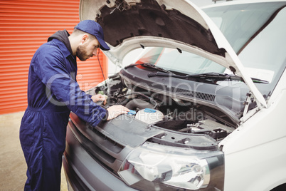 Mechanic fixing a van