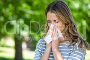 Woman using a tissue