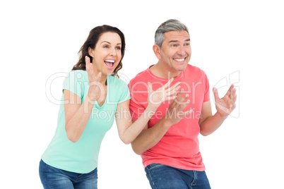 Excited couple cheering