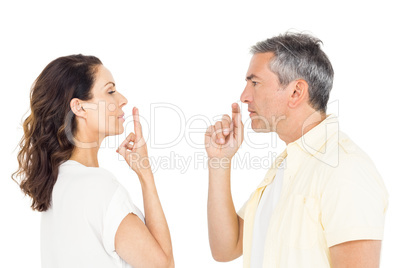 Focused couple gesturing