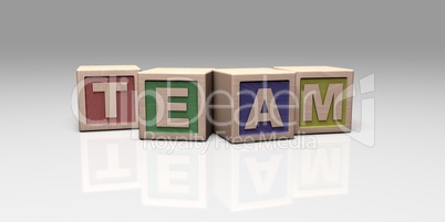 TEAM written with wooden blocks