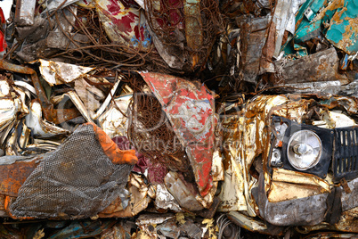 A pile of compressed cars in blocks for processing