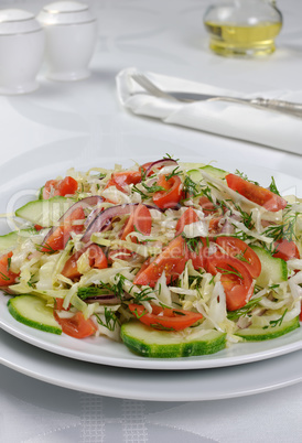 Cabbage salad with cucumber and tomatoes