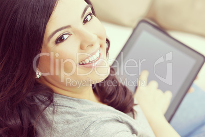 Happy Hispanic Woman Using Tablet Computer or iPad