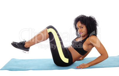 African American woman sitting on floor.