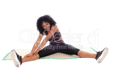 African American woman stretching.