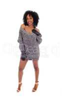 African American woman standing in sweater.
