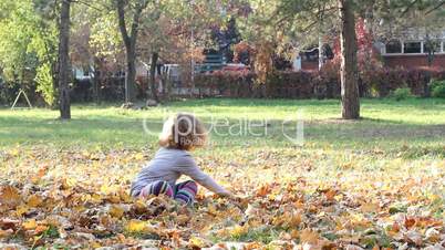 little girl fun in park autumn scene