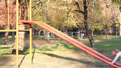 little girl fun on playground slide