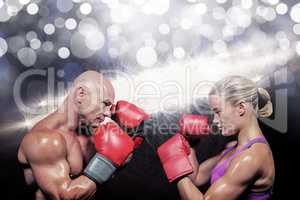 Composite image of side view of boxers with fighting stance
