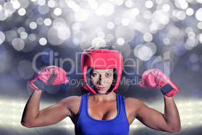 Composite image of portrait of female fighter with gloves and he