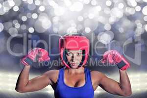 Composite image of portrait of female fighter with gloves and he