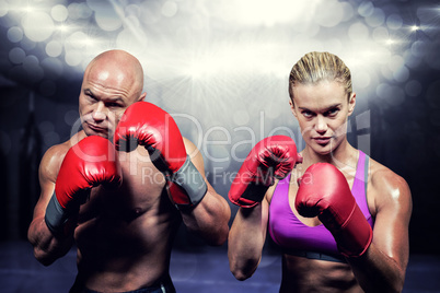 Composite image of portrait of boxers with gloves