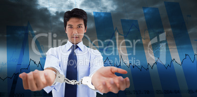 Composite image of businessman with handcuffs