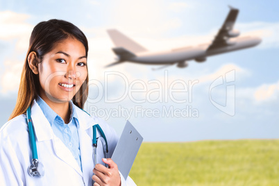 Composite image of asian doctor holding clipboard