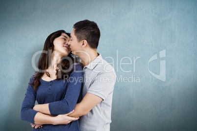 Composite image of affectionate couple embracing each other