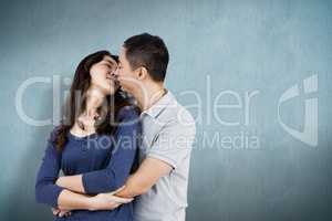 Composite image of affectionate couple embracing each other