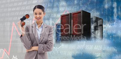 Composite image of portrait of a businesswoman holding binocular