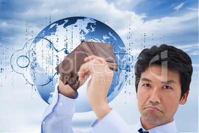 Composite image of businessman showing his empty wallet