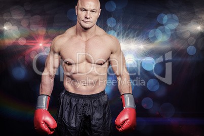 Composite image of portrait of bald man with boxing gloves