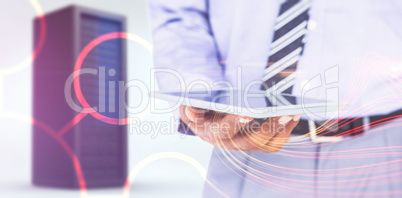 Composite image of  close up view of businessman using tablet co