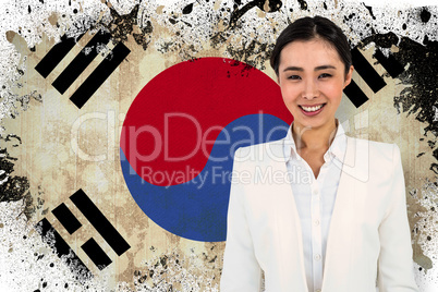Composite image of smiling businesswoman smartly dressed