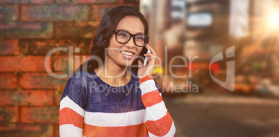 Composite image of asian woman on a phone call