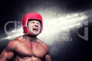 Composite image of angry boxer with headgear