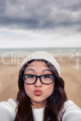 Composite image of asian woman making faces