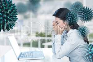 Composite image of worried businesswoman covering face