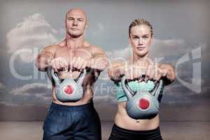Composite image of portrait of muscular man and woman lifting ke