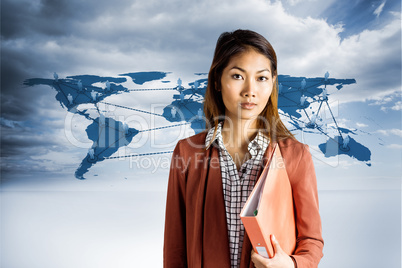 Composite image of businesswoman holding a binder