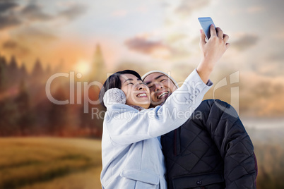Composite image of cute couple taking selfie