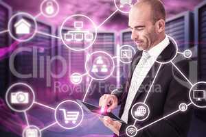 Composite image of businessman using a tablet