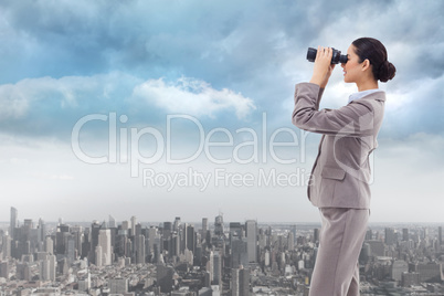 Composite image of portrait of a happy businesswoman looking thr